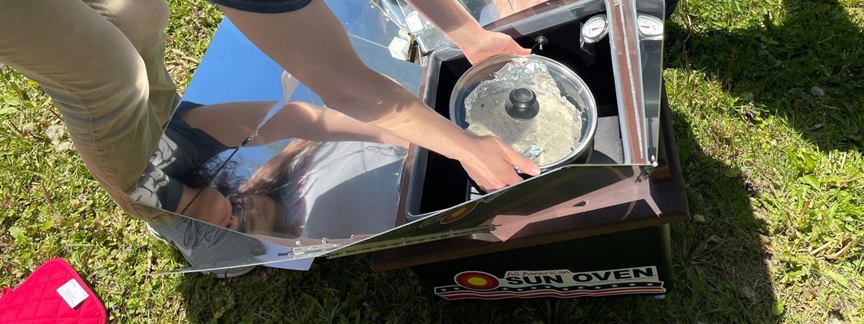 Environmental Science Students Use Solar Cooker to Bake Cake