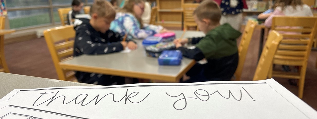 Students write thank you notes to adults