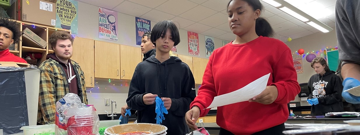 Students use snack foods and sweets to create edible landfills