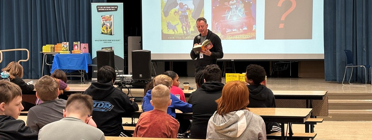 Author Erik Jon Slangerup reads an excerpt from his book during a grade-level assembly!