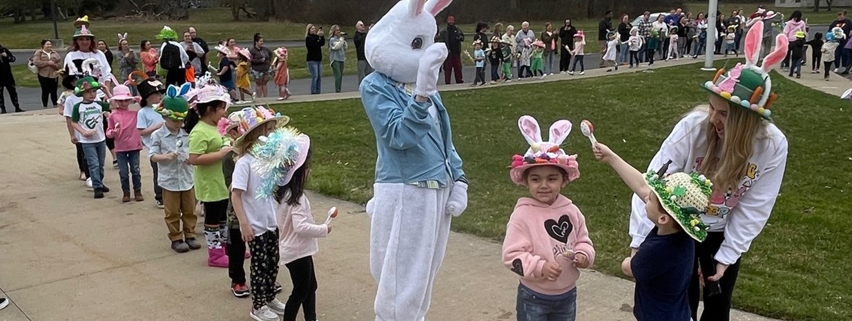 Preschool students celebrate Easter with a bonnet parade and egg hunt!