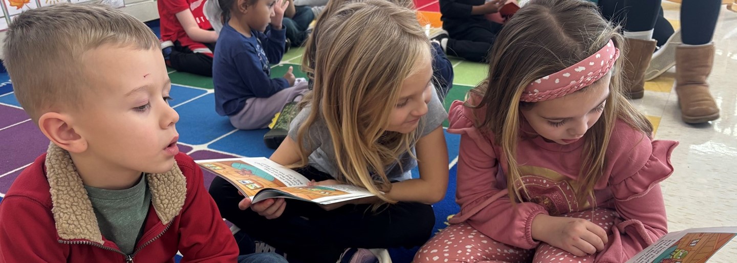 1st grade students read to our Mini-Dragons classes!