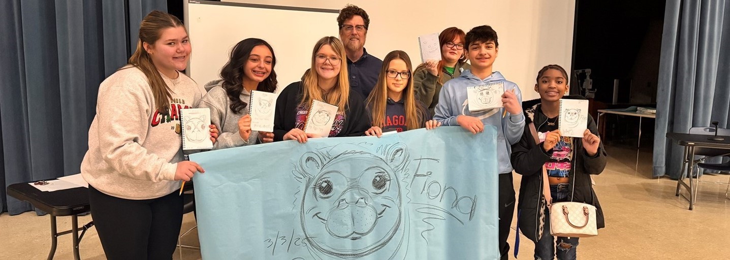 Children&#39;s book illustrator Richard Cowdrey shows students how to draw Fiona the Hippo!